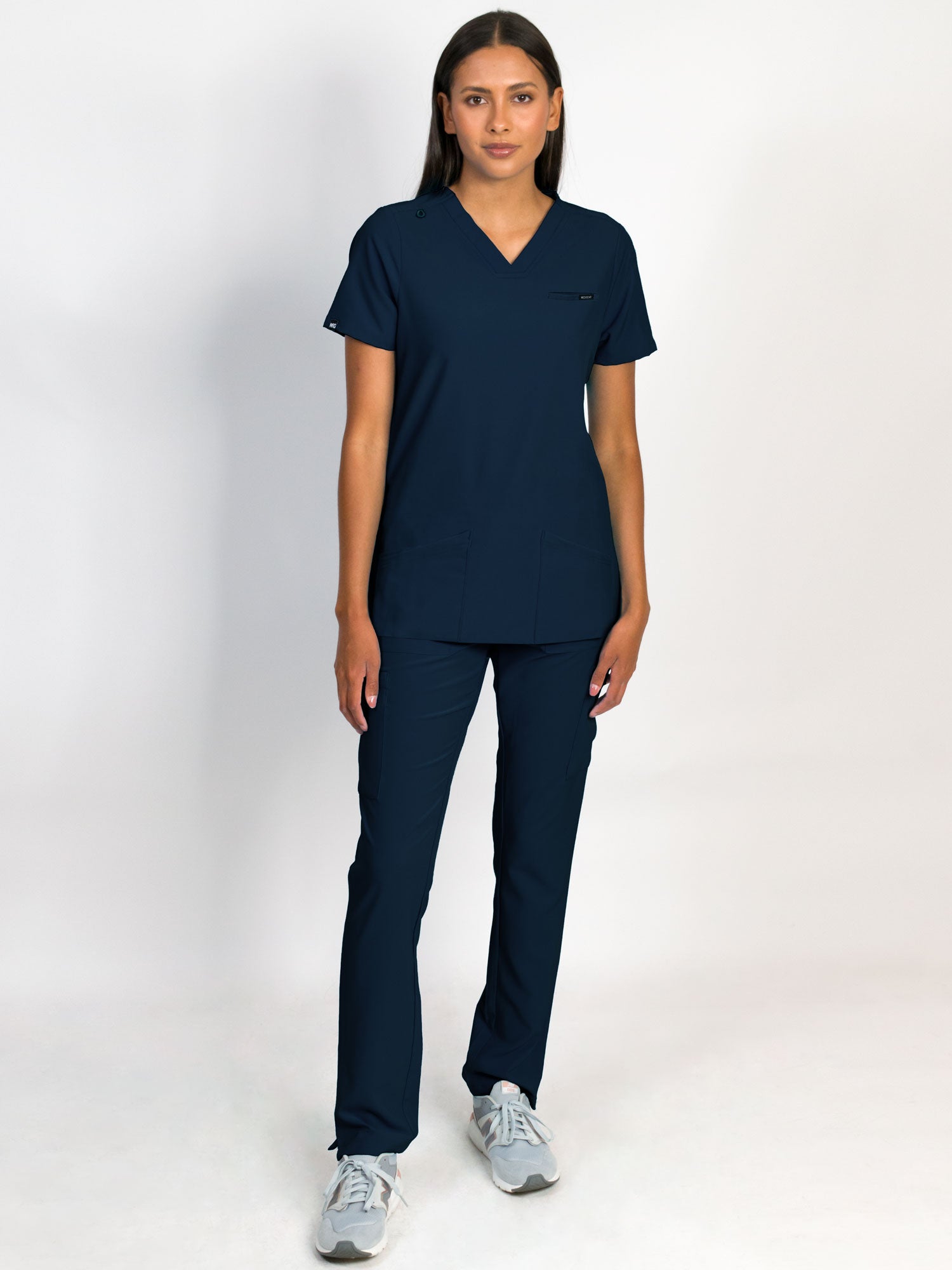 Scrub set in navy blue color, V-neck top with three bottom front patch pockets and a matching pants with multiple pockets.