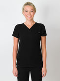 Black scrubs top with a single chest pocket and V-neck.
