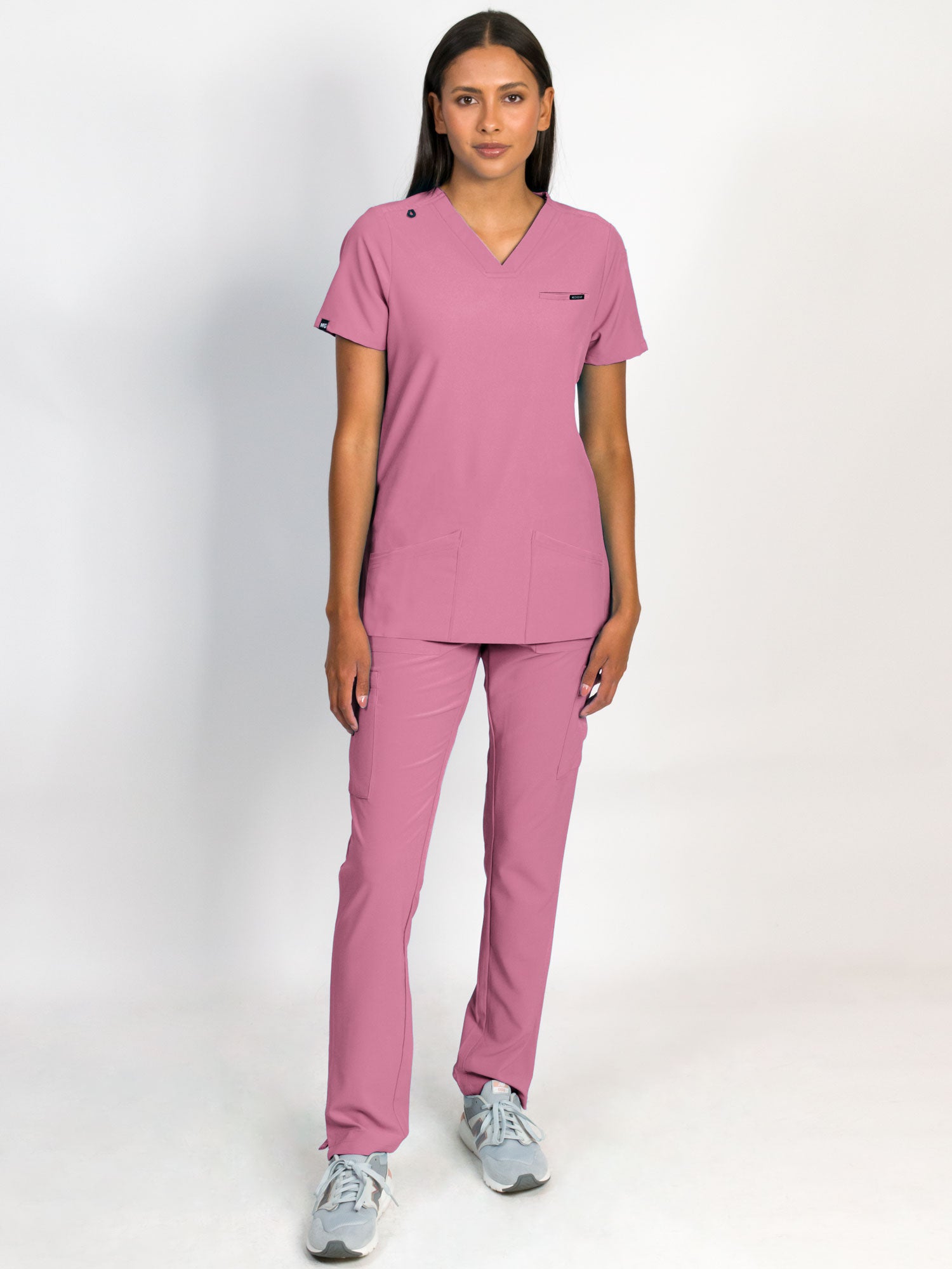Scrub set in mauve color, V-neck top with three bottom front patch pockets and a matching pants with multiple pockets.