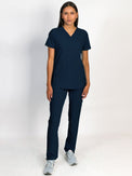 Scrub set in navy blue color, V-neck top with three bottom front patch pockets and a matching pants with multiple pockets.