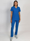 Royal blue scrubs set, V-neck top with three bottom front patch pockets and a pair of slim straight leg pants with an adjustable drawstring, both featuring multiple pockets designed for medical professionals.