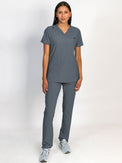 Grey scrubs set, V-neck top with three bottom front patch pockets and a matching grey pant with multiple pockets.